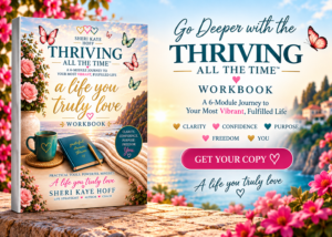 Book cover for 'Thriving All the Time: a life you truly love' by Sheri Kaye Hoff, on a wooden surface with a teal mug, flowers, and a beach sunset background.